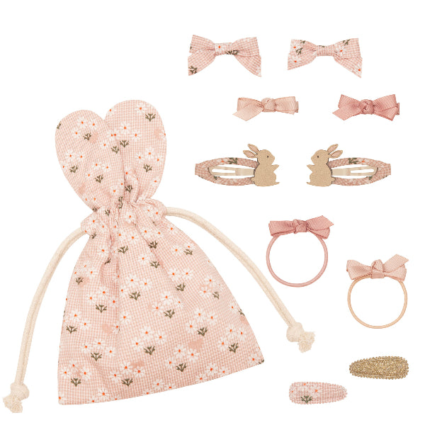  charming pink Easter-themed hair accessory set from Sonny Bear Mimi & Lula, featuring a fabric drawstring pouch with bunny-ear-shaped tops, decorated with a floral gingham pattern. The set includes multiple hair accessories: two fabric bow clips, two ribbon bow hair ties, two bunny-shaped hair clips with floral fabric details, a glittery gold barrette, and a small floral fabric snap clip. The accessories are in soft pastel shades, perfect for a delicate and whimsical look.