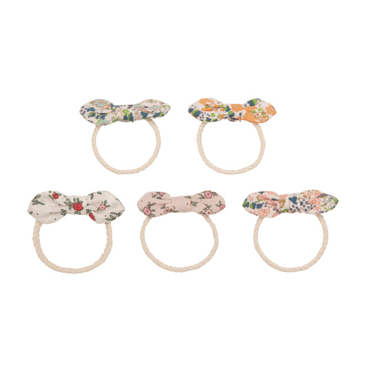 A set of five fabric bow hair ties from Sonny Bear Mimi & Lula. Each hair tie features a small bow made from floral-patterned fabric in various colors, including white, pink, blue, and orange. The bows are attached to cream-colored twisted rope hair bands. The bows have delicate floral designs, giving them a vintage-inspired aesthetic."