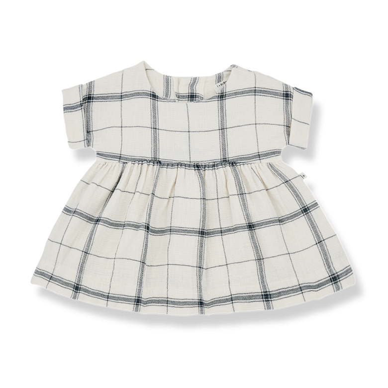 Baby dress with a plaid pattern in neutral tones of beige, brown, and navy. Features short sleeves, a round neckline, and a gathered waist for a slightly flared silhouette. Made from soft, lightweight fabric, perfect for comfortable everyday wear. Brand label "1+ in the family" visible inside the collar.